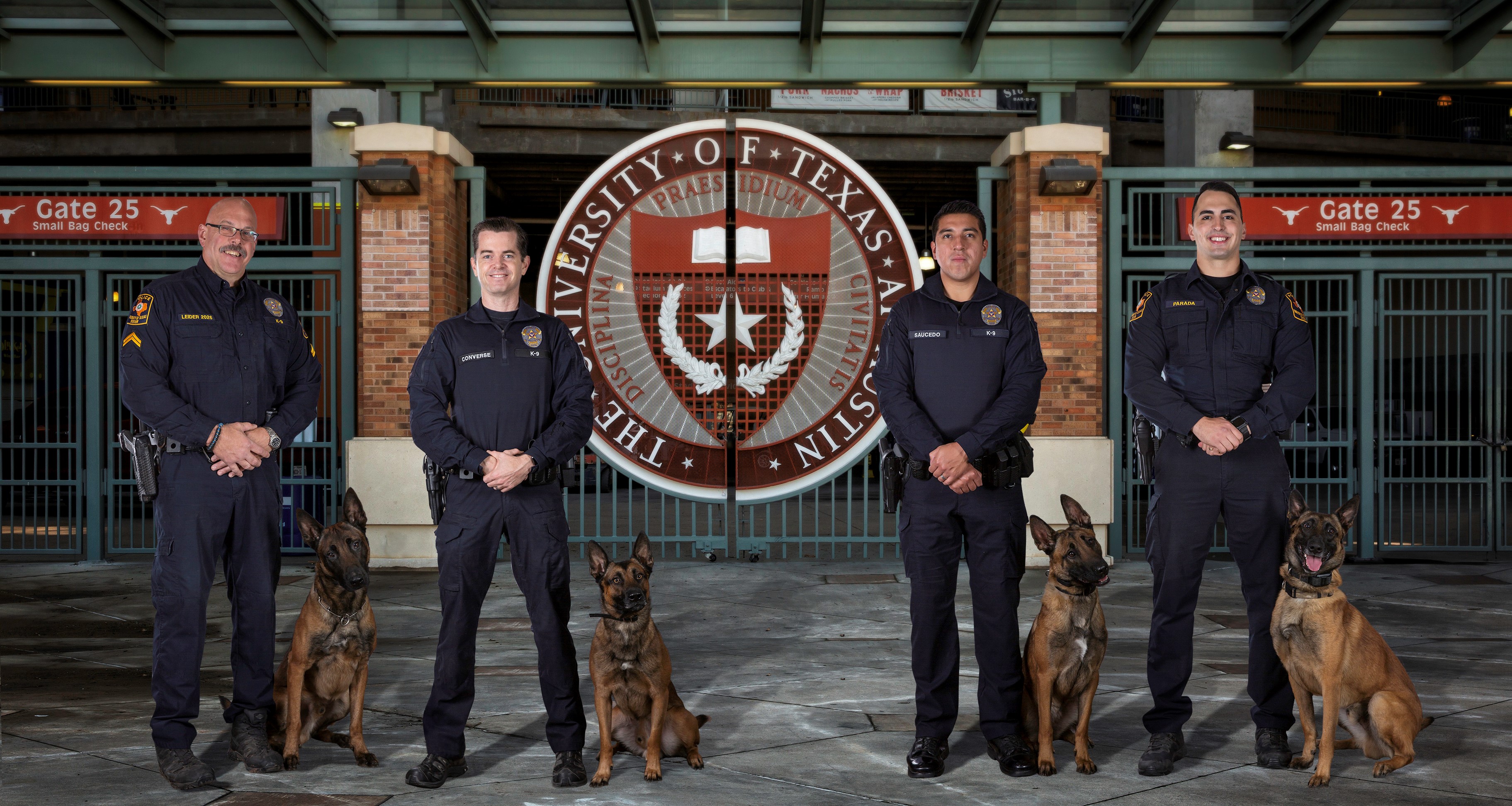 K9 officers and dogs standing for a photo