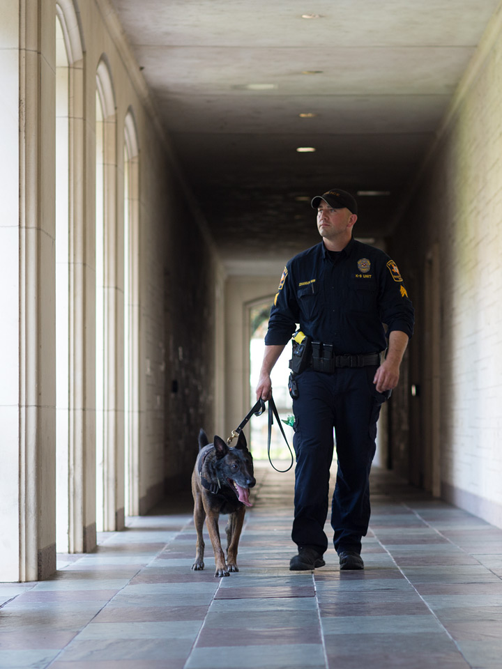 K9 dog and handler walking in hallway
